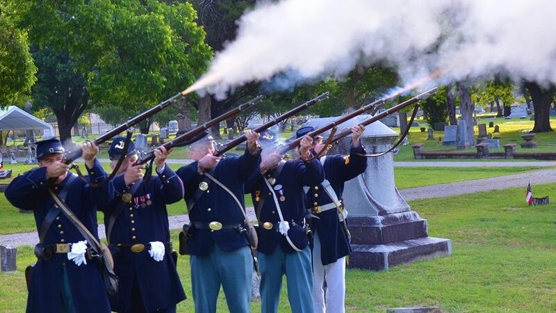 SUVCW members fire rifles in Civil War uniforms