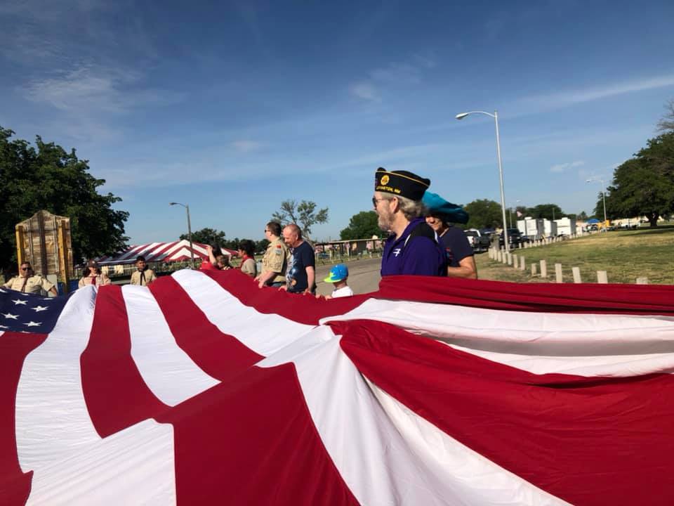 Boy Scouts raising flag at park