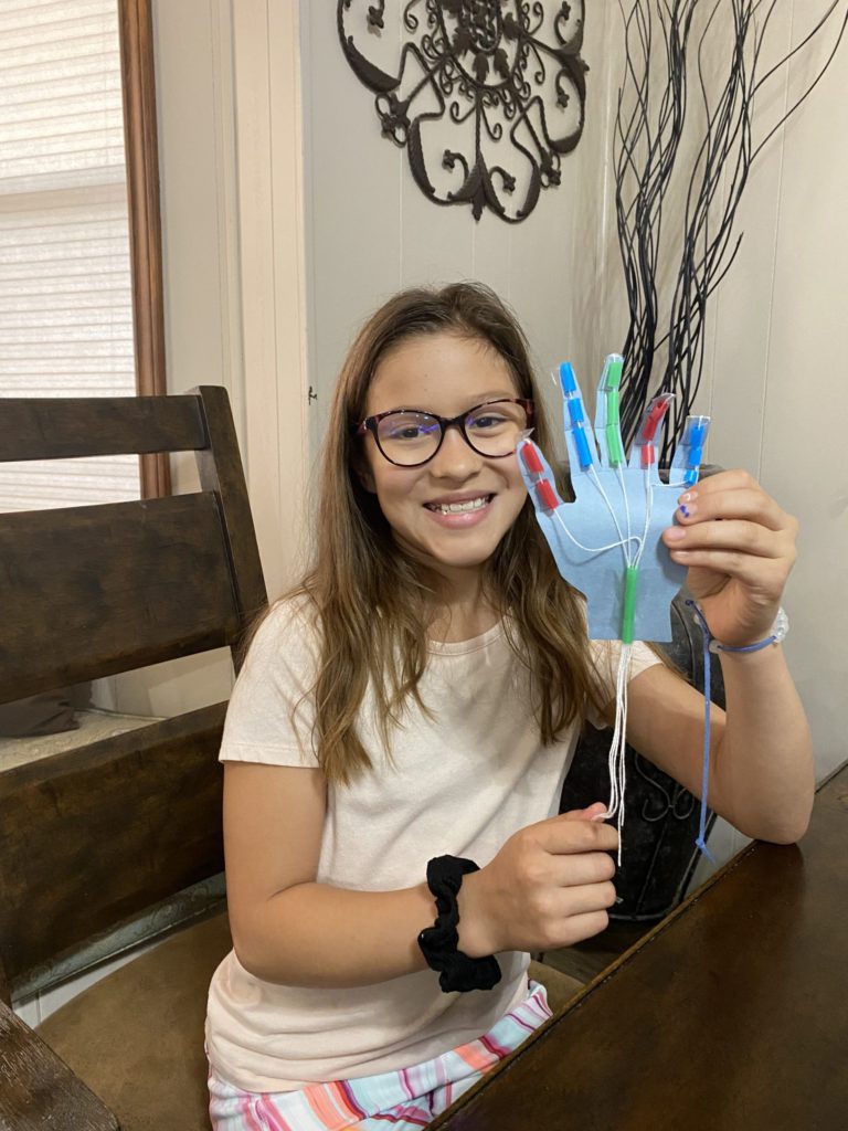 Girl made robotic hand at STEM camp