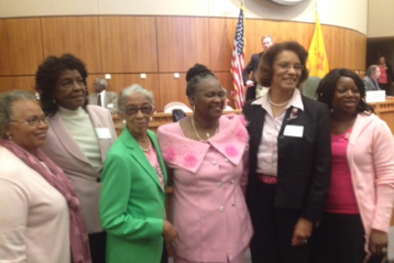 Sheryl Williams Stapleton with others on NM House floor