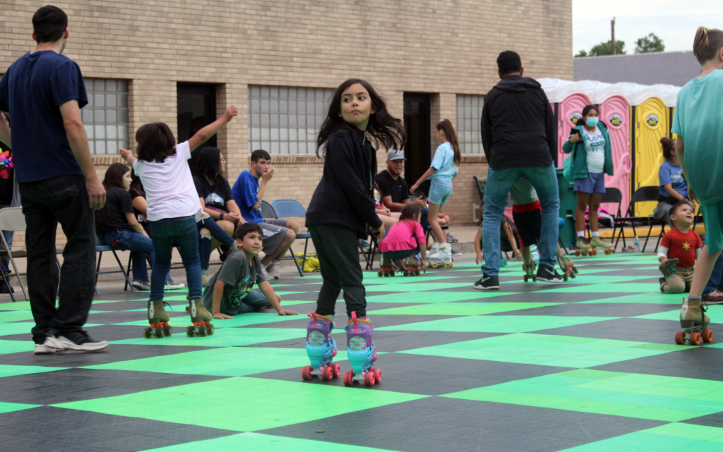 Little girl looking back while roller skating