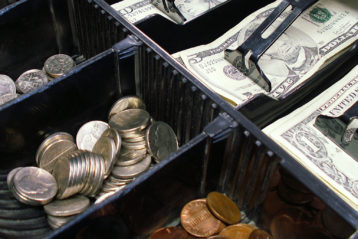 US money in cash register drawer