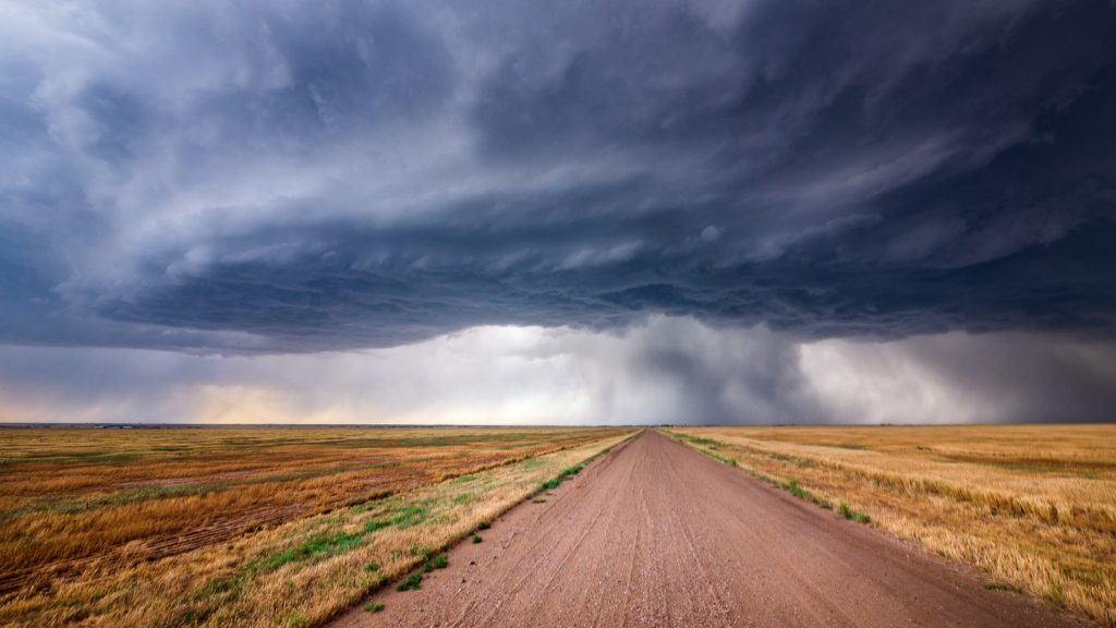 Open dirt road with clouds