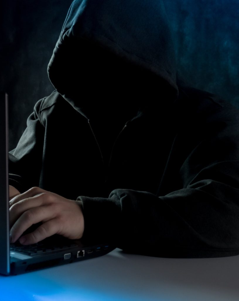 Hacker in dark hoodie