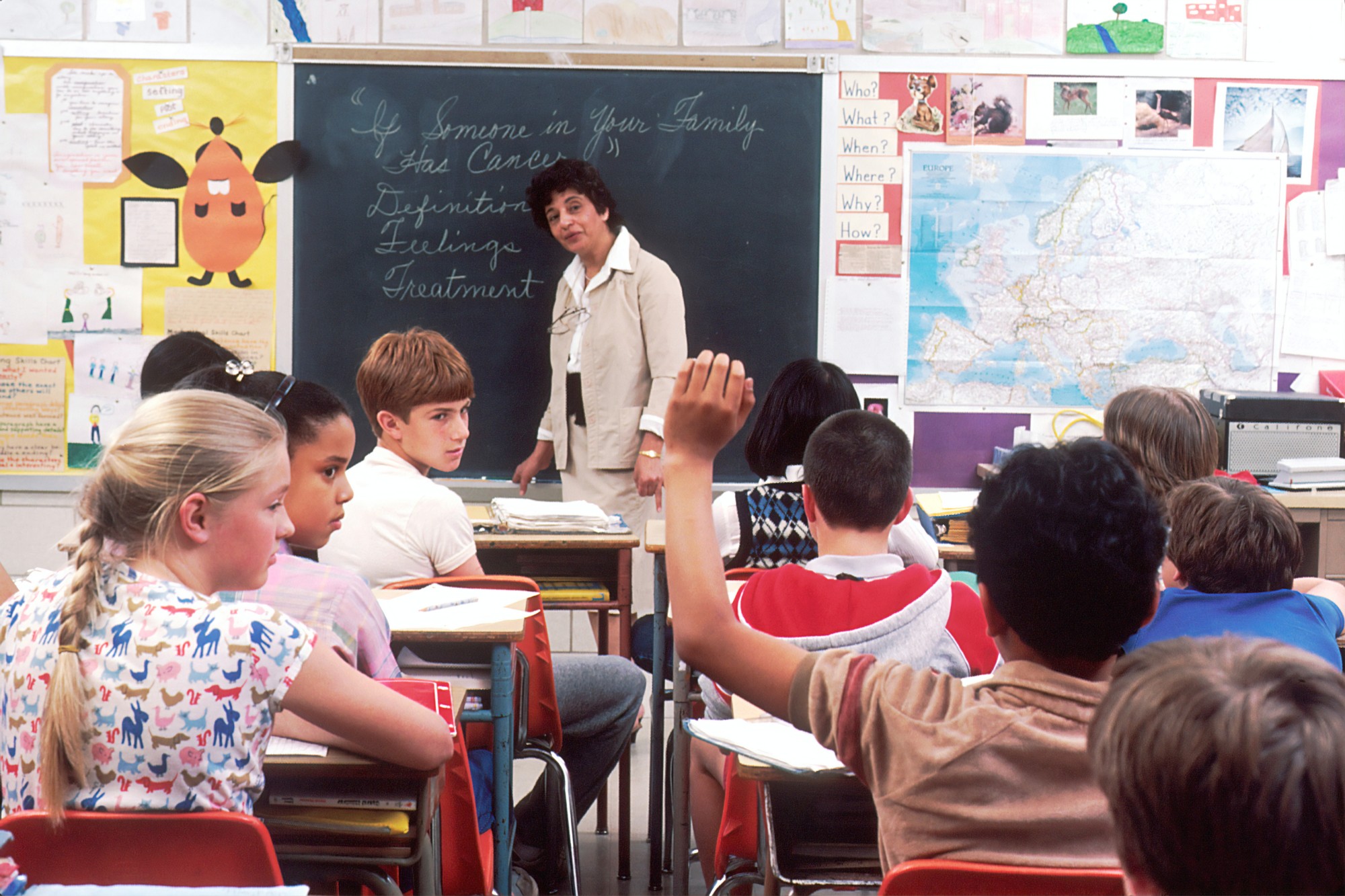 School classroom kid raising hand