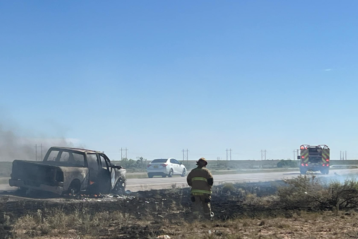 Firefighters responding to grass fire